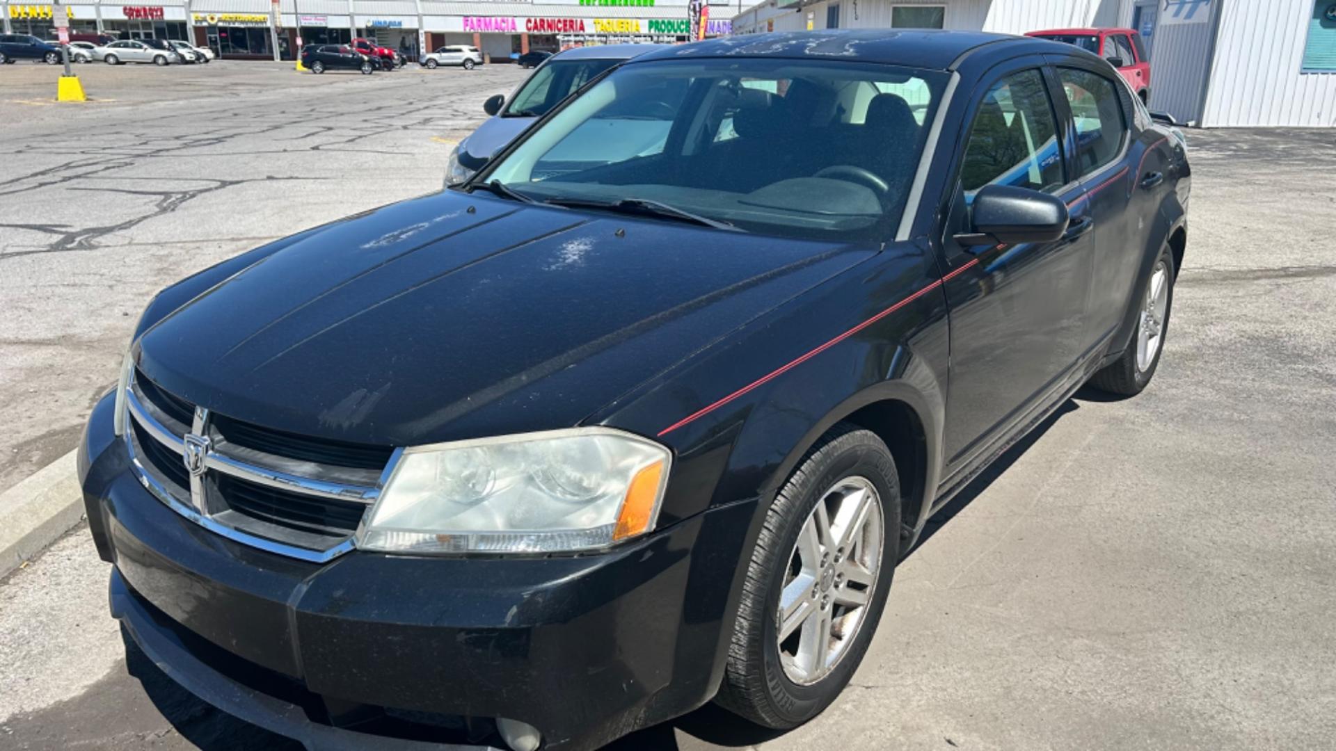 2009 Black Dodge Avenger SXT (1B3LC56B29N) with an 2.0L L4 DOHC 16V engine, 4-Speed Automatic Overdrive transmission, located at 2710A Westlane Rd., Indianapolis, IN, 46268, (317) 291-2000, 39.885670, -86.208160 - Photo#1